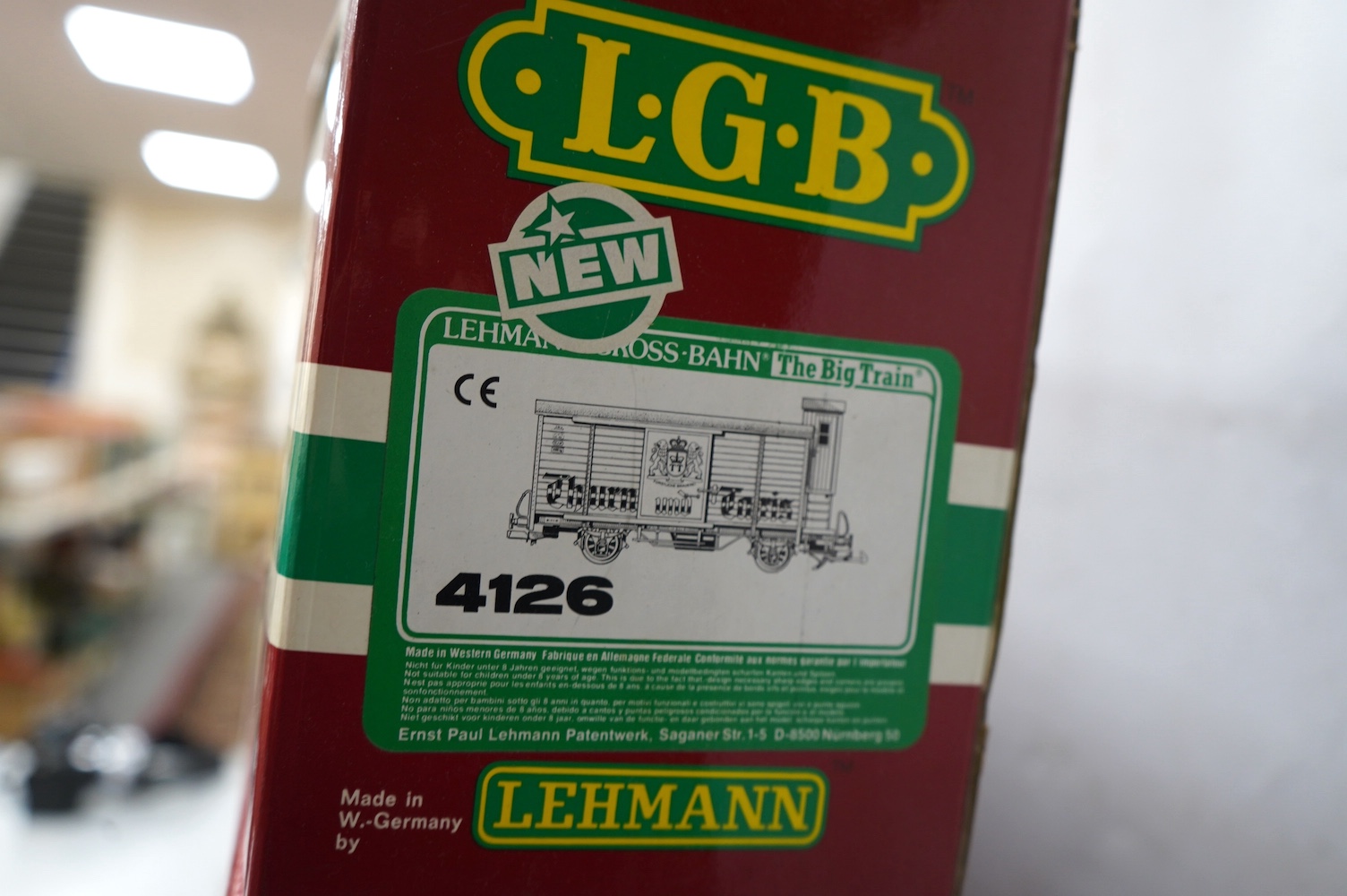 Three boxed Lehmann LGB G scale rolling stock; a bogie well wagon with transformer load (4058), A bogie beer box van (40570), and a 4-wheel box van (4126). Condition - good.